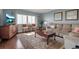 Bright living room with hardwood floors, water views, and comfortable seating at 6430 Sun Eagle Ln # 201, Bradenton, FL 34210