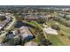 Aerial view of condos and golf course surrounded by a beautiful scenery at 6609 Stone River Rd # 206, Bradenton, FL 34203