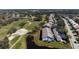 A stunning aerial view of residences and golf course, showcasing the community's beautiful landscape and prime location at 6609 Stone River Rd # 206, Bradenton, FL 34203