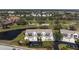 Beautiful view of condos next to a golf course and pond from above at 6609 Stone River Rd # 206, Bradenton, FL 34203