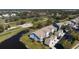 An aerial view of residences near the golf course, highlighting the buildings' design and a picturesque community setting at 6609 Stone River Rd # 206, Bradenton, FL 34203