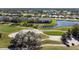 Aerial view of condos next to the pond, golf course, and beautiful scenery at 6609 Stone River Rd # 206, Bradenton, FL 34203