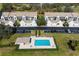 Aerial view of the pool and well maintained condos and garages at 6609 Stone River Rd # 206, Bradenton, FL 34203