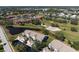 Aerial view of condos, lake, and golf course in a beautiful scenery at 6609 Stone River Rd # 206, Bradenton, FL 34203