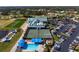 An overhead view highlights a pool, tennis courts, and clubhouse, perfect for community recreation and leisure activities at 6609 Stone River Rd # 206, Bradenton, FL 34203
