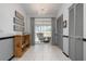 Hallway leading to sliding door, tile flooring, and rustic wood decorations at 6609 Stone River Rd # 206, Bradenton, FL 34203
