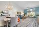 Bright living room with vaulted ceiling, modern furnishings, and a glimpse of the outdoor patio at 6609 Stone River Rd # 206, Bradenton, FL 34203