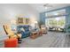 Inviting living room featuring a vaulted ceiling, comfortable seating, and a sunny view of the patio at 6609 Stone River Rd # 206, Bradenton, FL 34203