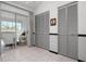 Bright living space with large sliding glass doors leading to a screened lanai and convenient closet storage at 6609 Stone River Rd # 206, Bradenton, FL 34203