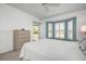 Charming main bedroom featuring natural light from a bay window and an adjacent balcony at 6609 Stone River Rd # 206, Bradenton, FL 34203