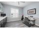 Bright office with built-in cabinets, desk space, and a window with shutter blinds at 6609 Stone River Rd # 206, Bradenton, FL 34203