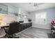 Office with built-in cabinets, desk space, ceiling fan, and natural light at 6609 Stone River Rd # 206, Bradenton, FL 34203