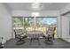 Enclosed patio with table and chairs offering views of the golf course at 6609 Stone River Rd # 206, Bradenton, FL 34203