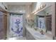 Bathroom with double vanity and walk-in shower at 6615 13Th E Ave, Bradenton, FL 34208