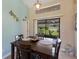 Casual dining area with sliding glass doors to backyard at 6615 13Th E Ave, Bradenton, FL 34208