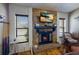 Stone fireplace with built-in shelving and TV at 6615 13Th E Ave, Bradenton, FL 34208