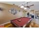 Pool table in game room with kitchen view at 6615 13Th E Ave, Bradenton, FL 34208