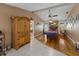 Game room features a pool table, fireplace, and wood flooring at 6615 13Th E Ave, Bradenton, FL 34208