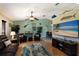 Spacious living room features a large TV, comfortable seating, and a relaxing atmosphere at 6615 13Th E Ave, Bradenton, FL 34208