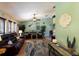 Relaxing living room with leather furniture, ceiling fan and beachy decor at 6615 13Th E Ave, Bradenton, FL 34208