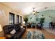 Bright and airy living room with leather furniture and coastal-themed decor at 6615 13Th E Ave, Bradenton, FL 34208