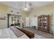 Main bedroom with king bed and built-in shelving at 6615 13Th E Ave, Bradenton, FL 34208