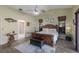 Main bedroom with king bed and access to patio at 6615 13Th E Ave, Bradenton, FL 34208