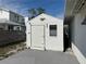 White storage shed with a deck and eagle emblem at 690 Broadway St, Longboat Key, FL 34228