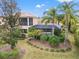 Backyard oasis with a screened pool and lush landscaping at 7033 Brier Creek Ct, Lakewood Ranch, FL 34202