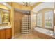 Elegant bathroom with a glass shower, soaking tub, and dual sinks at 7033 Brier Creek Ct, Lakewood Ranch, FL 34202