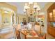 Open dining room with view into living area and kitchen at 7033 Brier Creek Ct, Lakewood Ranch, FL 34202