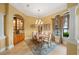 Elegant formal dining room with built-in cabinetry and chandelier at 7033 Brier Creek Ct, Lakewood Ranch, FL 34202