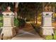 Community entrance with lighted stone pillars and a walkway at 7033 Brier Creek Ct, Lakewood Ranch, FL 34202