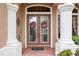 Elegant entryway with double doors and decorative wreaths at 7033 Brier Creek Ct, Lakewood Ranch, FL 34202