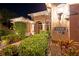 Night view of home's entryway, featuring well-manicured landscaping and lighting at 7033 Brier Creek Ct, Lakewood Ranch, FL 34202