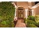 Elegant entryway with double doors and brick walkway at 7033 Brier Creek Ct, Lakewood Ranch, FL 34202