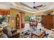 Gathering room with pool access and comfortable seating at 7033 Brier Creek Ct, Lakewood Ranch, FL 34202