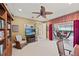 Bright home office with rocking chair and pool view at 7033 Brier Creek Ct, Lakewood Ranch, FL 34202