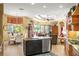 Open kitchen with island, granite countertops, and breakfast nook at 7033 Brier Creek Ct, Lakewood Ranch, FL 34202