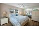 Main bedroom with white dresser and coastal bedding at 730 Holly Rd, Anna Maria, FL 34216