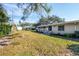 Landscaped backyard featuring flower beds and healthy lawn at 7422 W Country Club N Dr, Sarasota, FL 34243