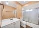 Bathroom vanity with mirror and shower tub combination with glass doors at 7422 W Country Club N Dr, Sarasota, FL 34243