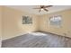 This bedroom features hardwood floors and two windows for natural light at 7422 W Country Club N Dr, Sarasota, FL 34243