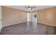 Spacious bedroom with gray floors and a view of the enclosed sunroom at 7422 W Country Club N Dr, Sarasota, FL 34243