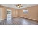 Cozy bedroom with gray floors and a large window with natural light at 7422 W Country Club N Dr, Sarasota, FL 34243