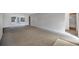 Large living room featuring neutral carpeting and lots of natural light at 7422 W Country Club N Dr, Sarasota, FL 34243