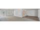 Bright, open living room with carpet and hardwood, leading to front entrance at 7422 W Country Club N Dr, Sarasota, FL 34243