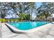 Community pool with lounge chairs at 7422 W Country Club N Dr, Sarasota, FL 34243