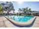 Community pool with lounge chairs at 7422 W Country Club N Dr, Sarasota, FL 34243