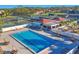 Community pool with lounge chairs and umbrellas, offering a relaxing atmosphere for residents at 7422 W Country Club N Dr, Sarasota, FL 34243